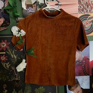 It’s a Medium crop top with a close-up neck